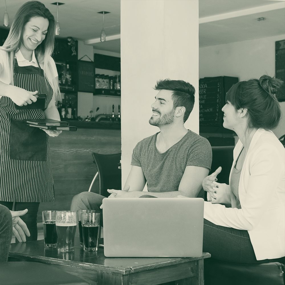 Customers being served at a cafe counter